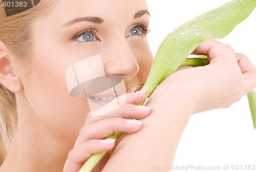 Image of happy woman with green leaf