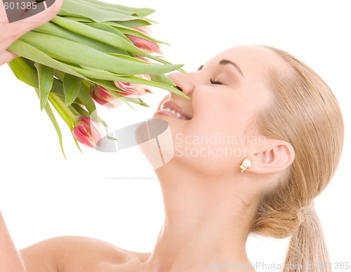 Image of happy woman with flowers