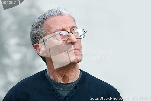 Image of A senior man looking up