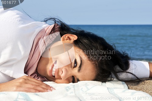 Image of Young native american woman at beach