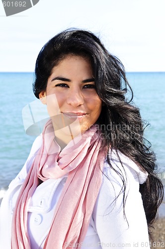 Image of Beautiful young woman at beach