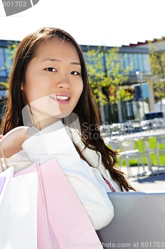 Image of Asian woman shopping