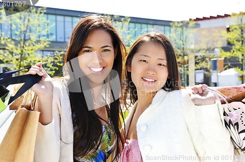 Image of Young girlfriends shopping