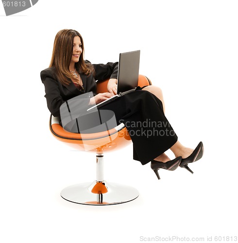 Image of businesswoman in chair with laptop