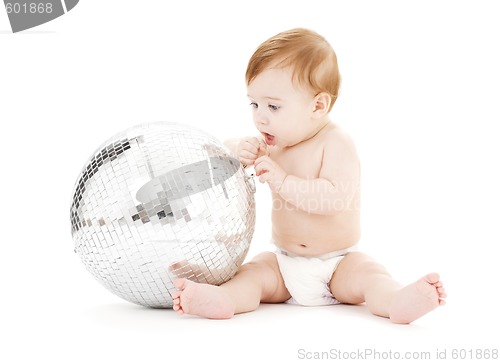 Image of adorable baby boy with big disco ball