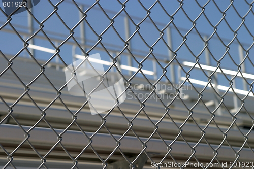 Image of Bleachers Behind Fence