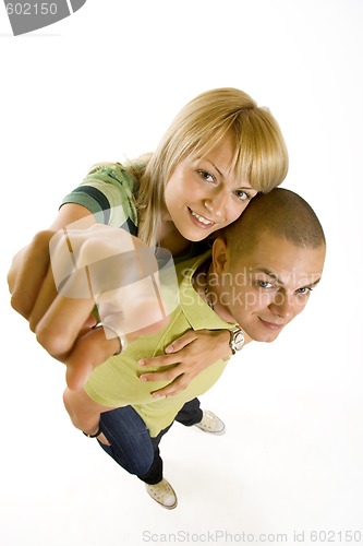 Image of wide angle picture of a young couple pointing