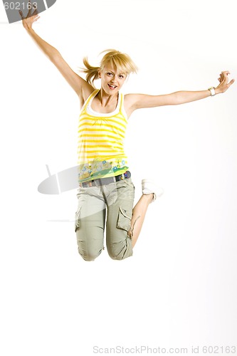 Image of casual young woman jumps in the air