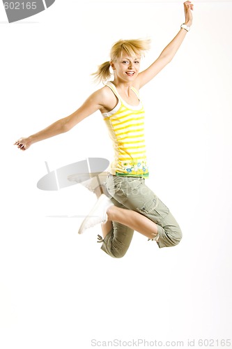 Image of casual young man jumps in the air