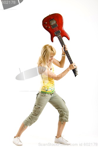 Image of portrait of an attractive woman guitarist
