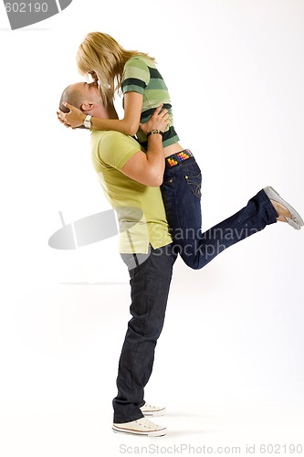 Image of young man holding his girlfriend