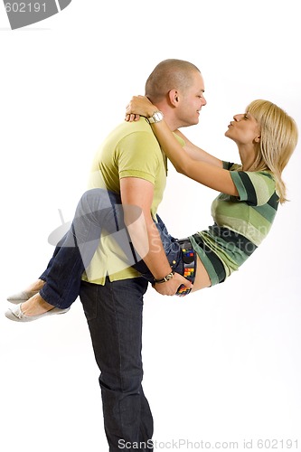 Image of young man holding his girlfriend