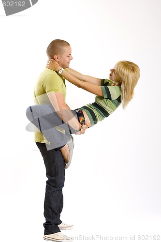 Image of young man holding his girlfriend on his back