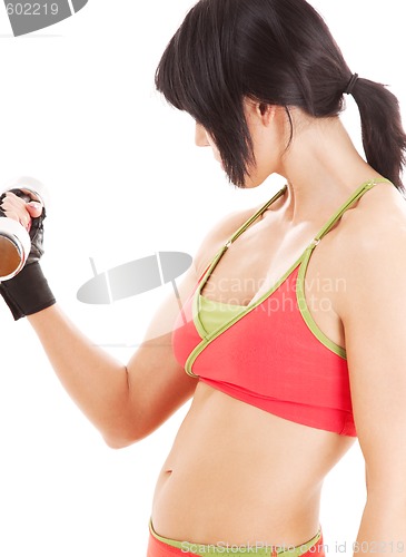 Image of muscular fitness instructor with dumbbells
