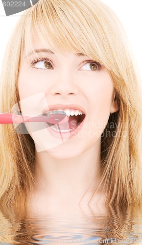 Image of happy girl with toothbrush