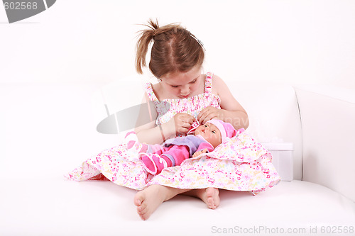 Image of Playing with doll