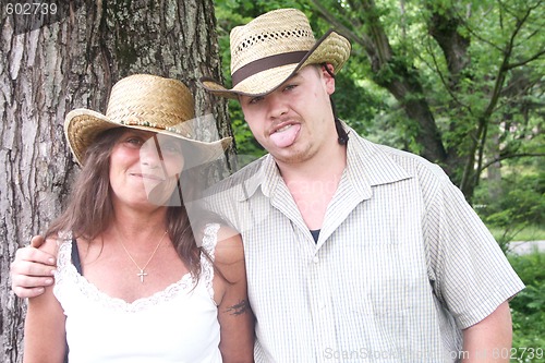 Image of Couple outside standing in front of a tree