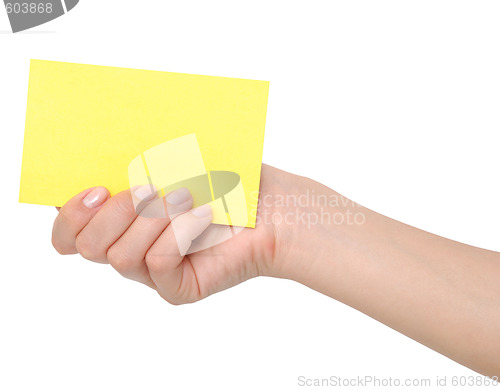 Image of yellow card in a hand