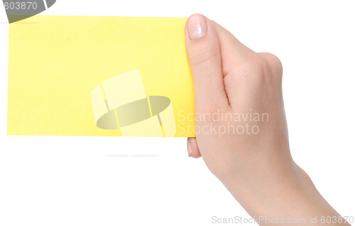 Image of yellow card in a hand