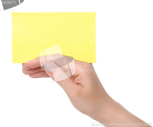 Image of yellow card in a hand