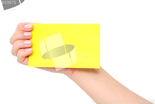 Image of yellow card in a hand