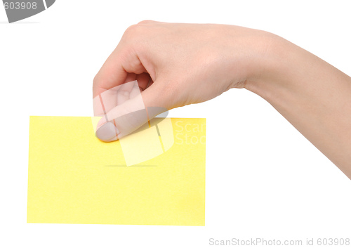 Image of yellow card in a hand