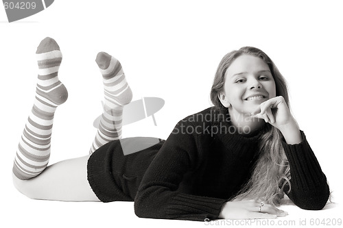 Image of beautiful smiling girl lies on the floor