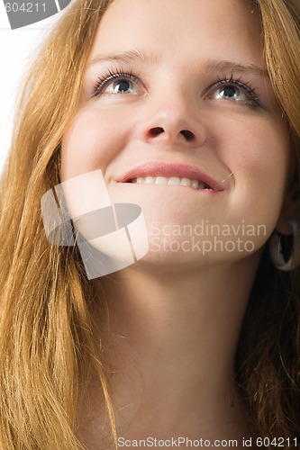 Image of beautiful girl bites lip