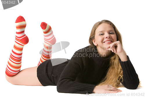 Image of beautiful smiling girl lies on the floor