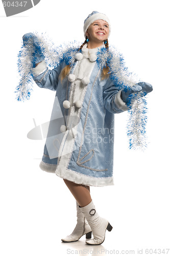 Image of Happy girl in snow maiden fur coat with tinsel