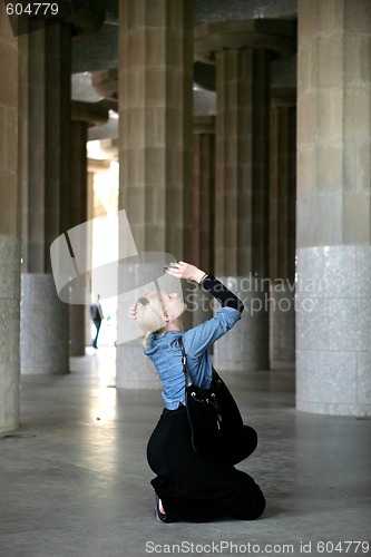 Image of Young woman take a photo in Hypostyle hall  at Guell Park