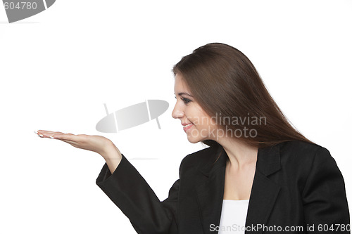 Image of Business woman looking at her empty hand