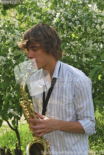 Image of young man with saxophone