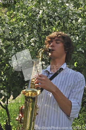 Image of young man with saxophone