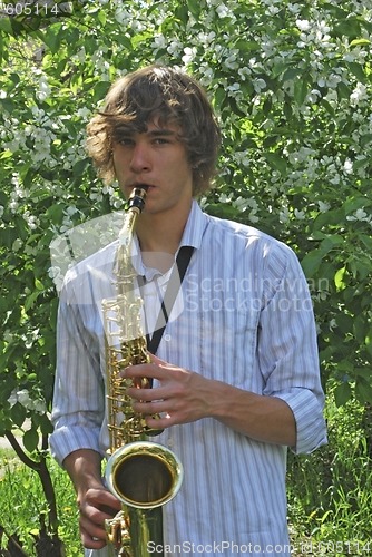 Image of young man with saxophone