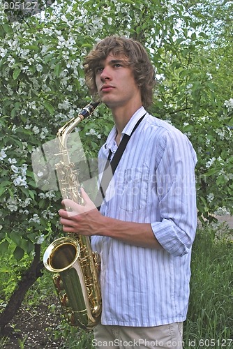 Image of young man with saxophone