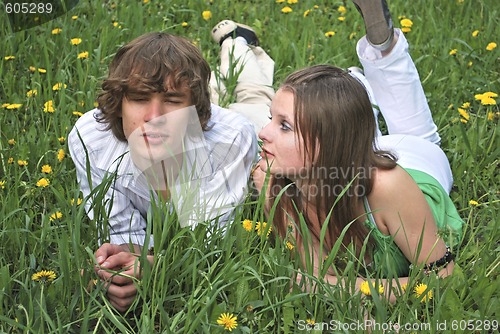 Image of beautiful girl and boy on lawn