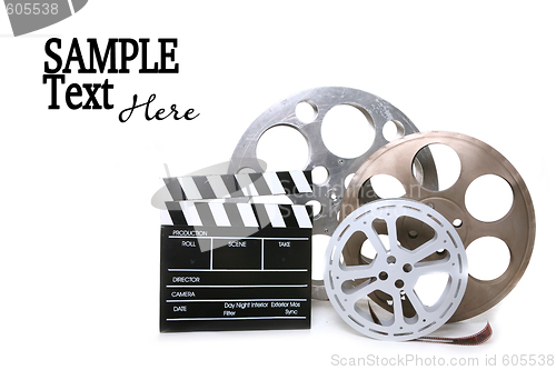 Image of Canisters of Film With Directors Clapboard on White Background