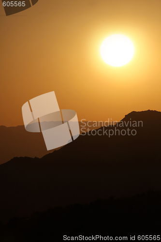 Image of Vertical Silhouette Sunrise of Hazy Misty Mountains