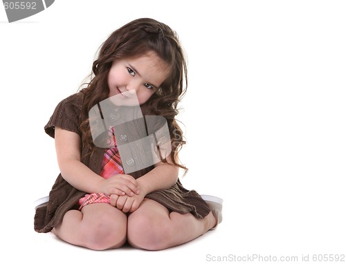 Image of Brown Haired Young Child Tilting Her Head Sideways