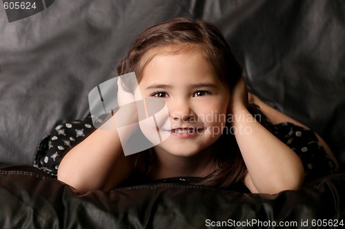 Image of Cute Young Child Covering Her Ears