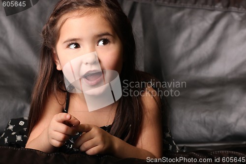 Image of Young Female Child Talking and Looking Up