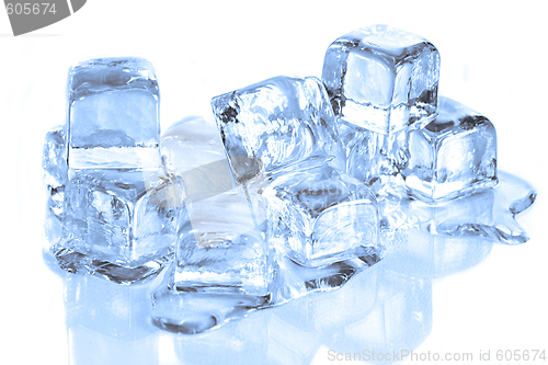 Image of Cool Ice Cubes Melting on a  White Reflective Surface