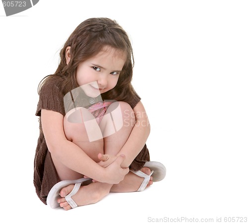 Image of Expressive Young Child Hugging Her Legs