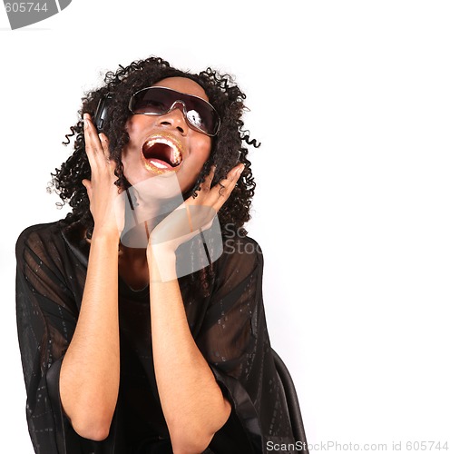 Image of Woman Singing While Listening to Music on Headphones