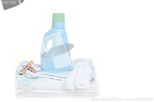 Image of Baby Blanket With Socks Clothespins and Detergent