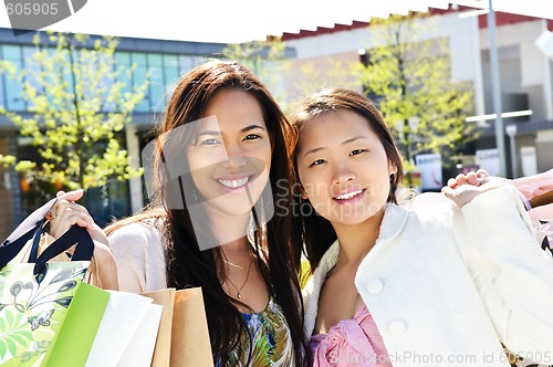 Image of Young girlfriends shopping