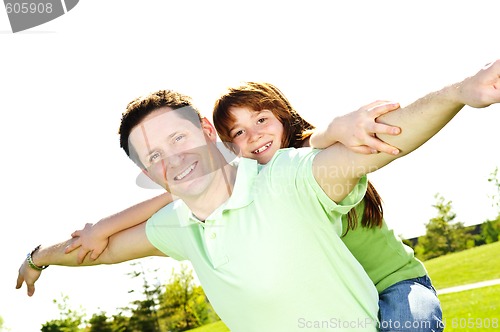 Image of Father and daughter piggyback