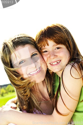 Image of Mother and daughter hugging