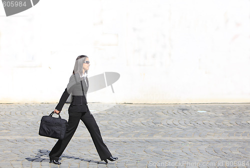 Image of Businesswoman in a hurry